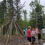 Students building a fort at camp