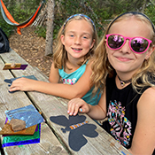 two girls crafting butterflies