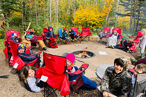 Students sitting around a firepit