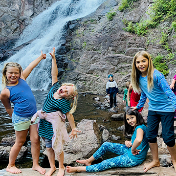 Birch Buddies outside enjoying a beautiful waterfall