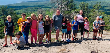 Student and teacher group photo out on a hike