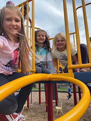 Girls on playground equipment