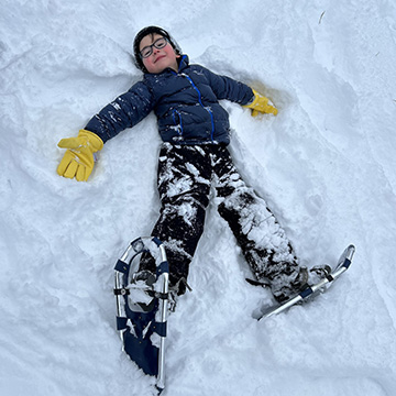 Student making a snow angel