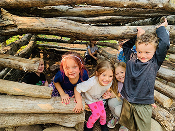 Group of happy students in an outside fort