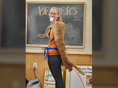 Staff member in beaver mascot costume